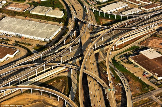 a-massive-and-confusing-intersecting-freeway-in-houston-texas-is-photographed-while-commuters-navigate-the-roads